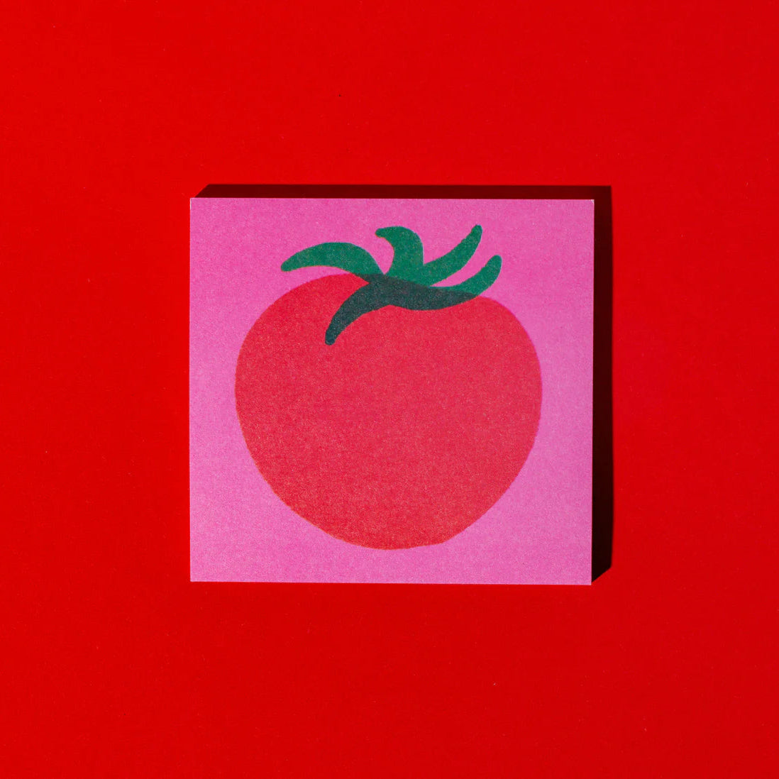 Square pink card with a red tomato illustration on a red background