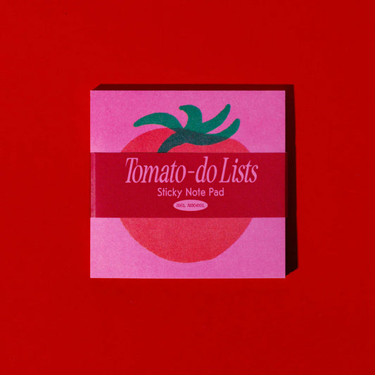 Pink 'Tomato-do Lists' sticky note pad with green leaf design on a red background