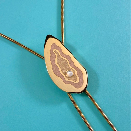MackBecks Gold-Plated Oyster Bolo on teal background.