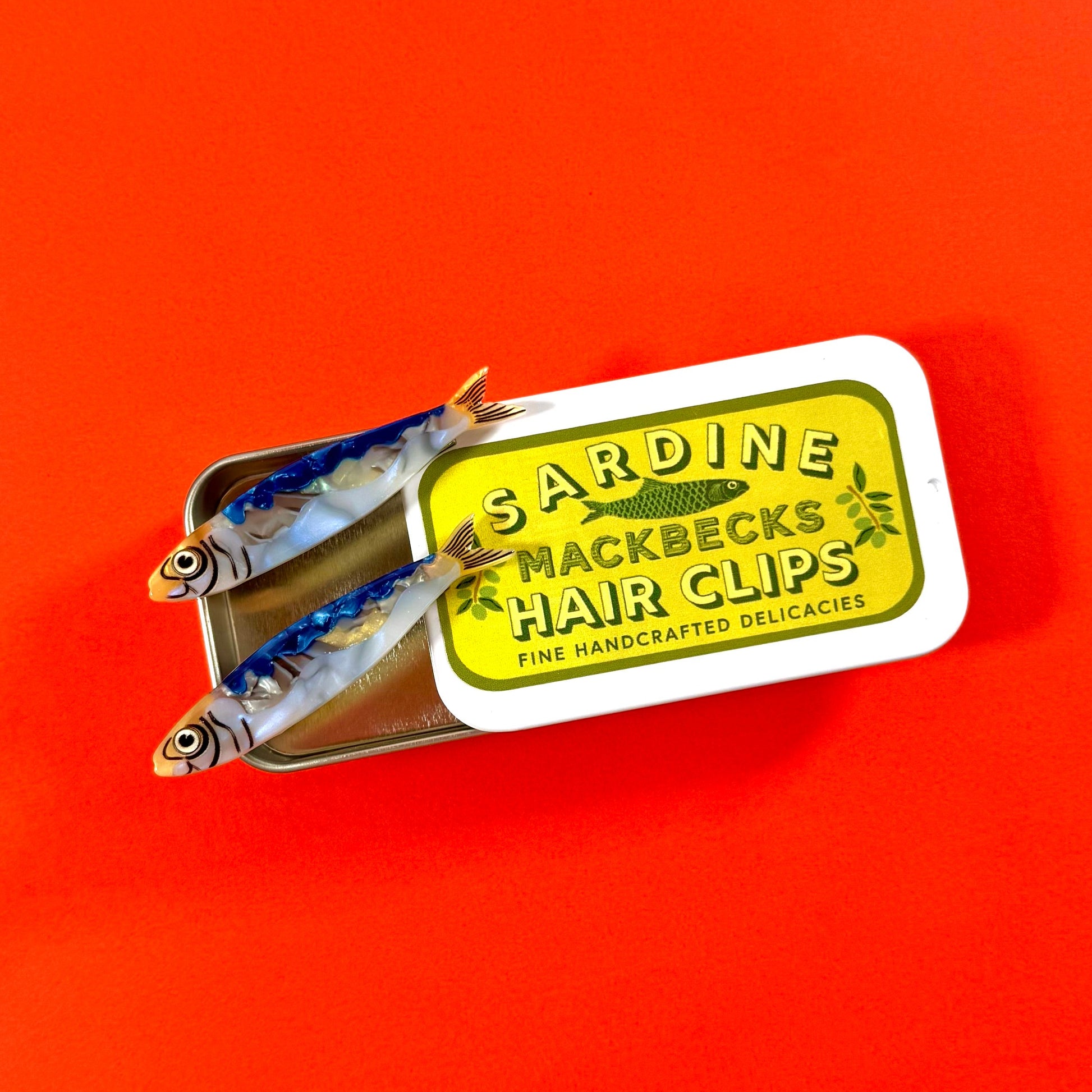 Sardine Hair Clips in Custom MackBecks Sardine Tin on Red Background